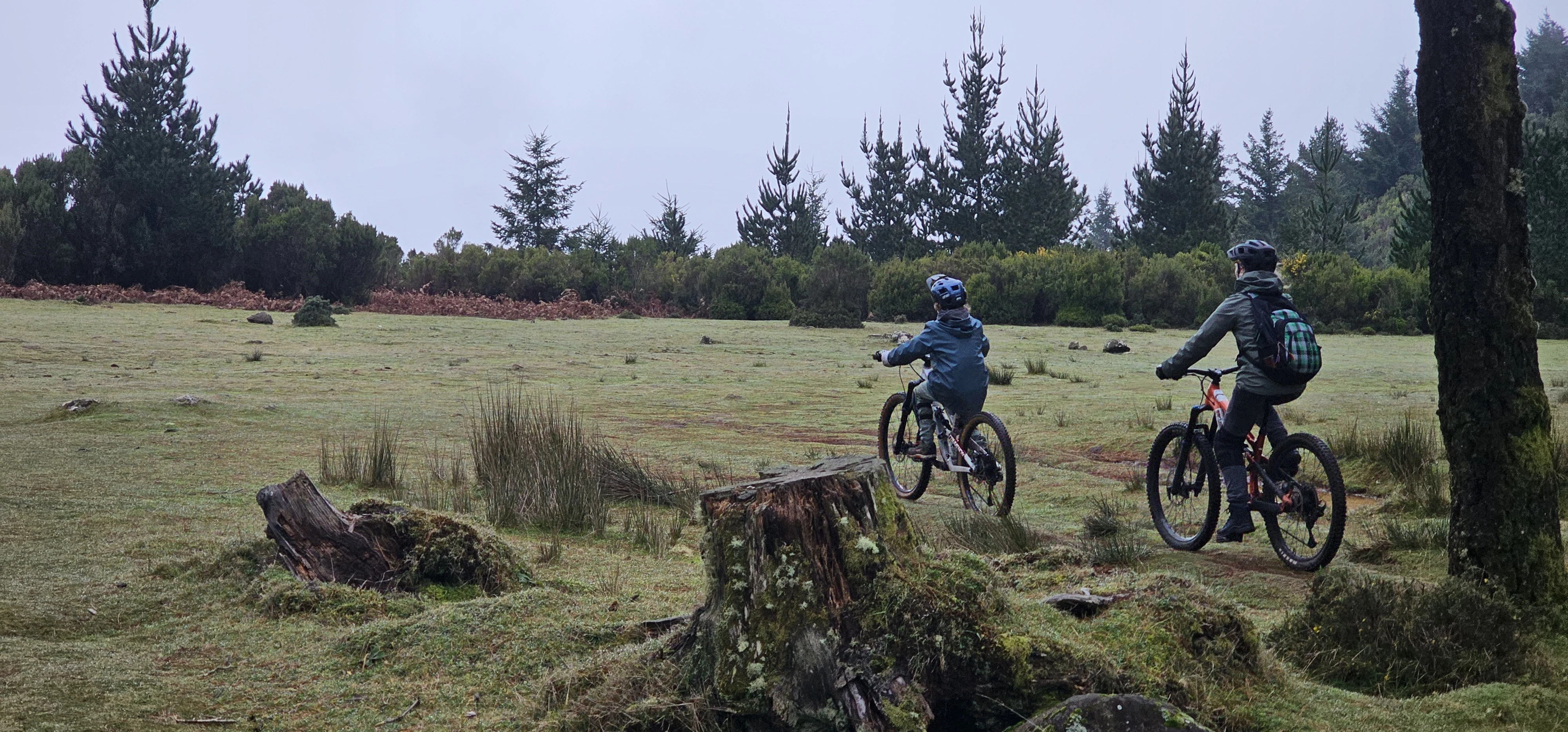 Happy family smiling after a group bike tour.